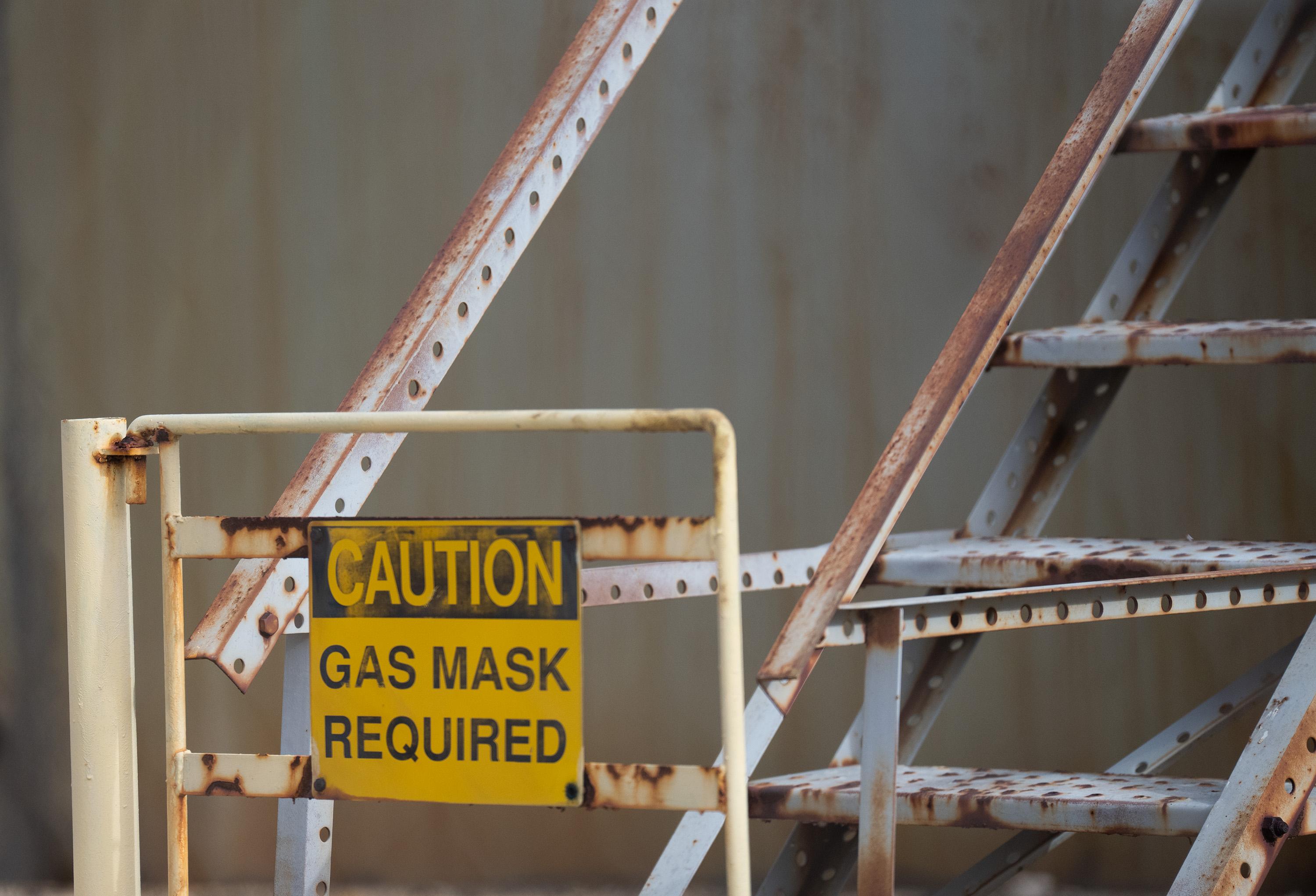 A warning sign near a tank in an oil storage facility in Odessa